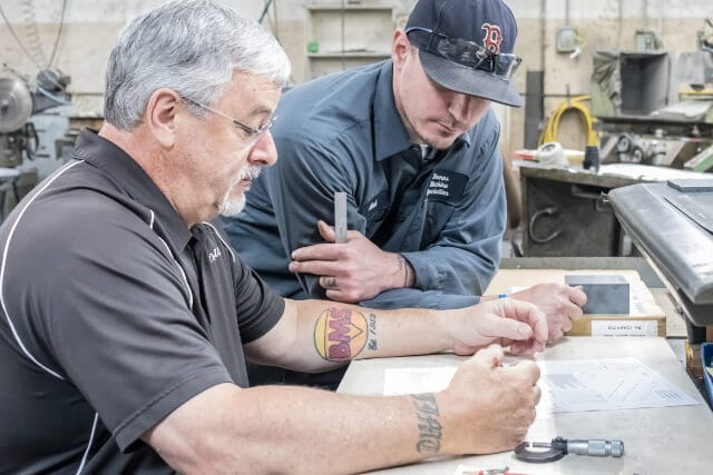 Joe and Mark Annese working in the machine shop at Bomas Machine Specialties